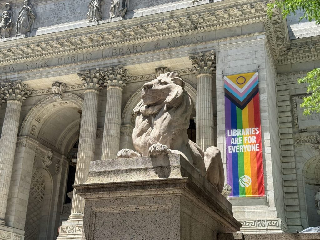 A banner against carved stone