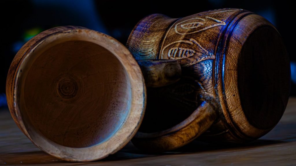 Two carved wooden vessels