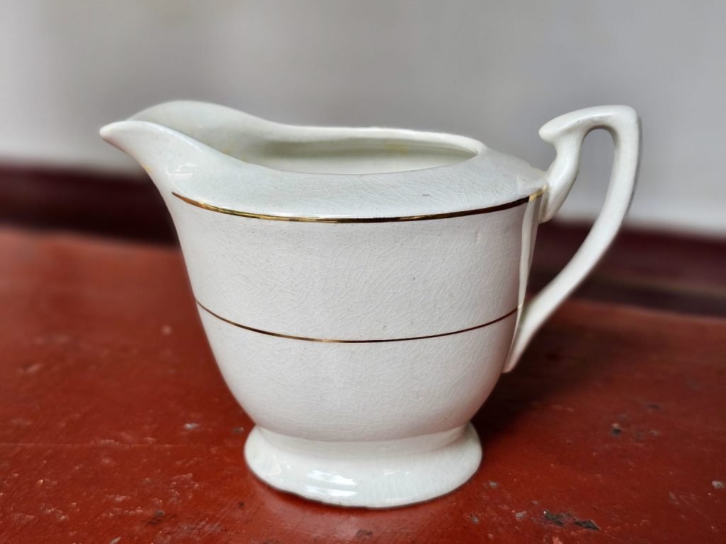 White jug with two gold bands