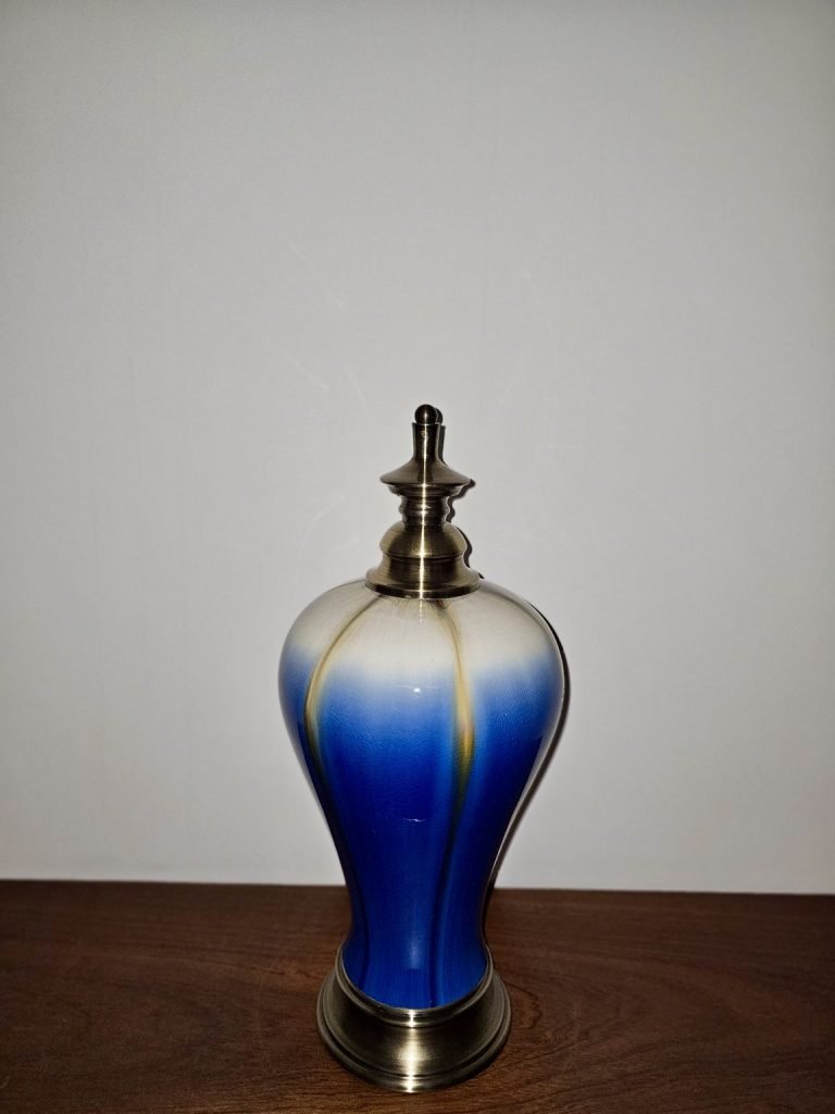Blue-and-white bottle with a metal lid
