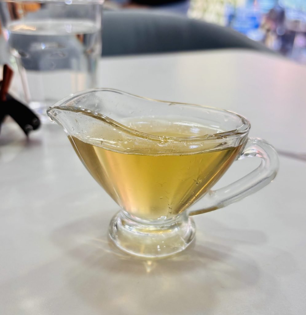 Small glass jug of pale golden liquid